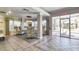 Inviting lobby area features tile floors, a decorative chandelier, and comfortable seating near large windows at 2937 S Atlantic Ave # 2001, Daytona Beach, FL 32118