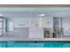 Indoor pool area with seating and shower, maximum depth of 6 feet at 2937 S Atlantic Ave # 2001, Daytona Beach, FL 32118