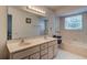 Bathroom features dual sinks, and a large mirror at 3119 Mango Tree Dr, Edgewater, FL 32141