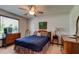 Cozy bedroom with natural light and wood furnishings at 3119 Mango Tree Dr, Edgewater, FL 32141