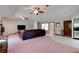 Bright living room with plush seating and tile flooring leading to front door at 3119 Mango Tree Dr, Edgewater, FL 32141