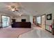 Open-concept living room features a fireplace and access to the screened patio at 3119 Mango Tree Dr, Edgewater, FL 32141