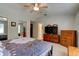 Spacious main bedroom showcasing large closet, ensuite bathroom, and furnishings at 3119 Mango Tree Dr, Edgewater, FL 32141