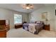 Comfortable bedroom featuring a ceiling fan, window, and furnishings at 3119 Mango Tree Dr, Edgewater, FL 32141