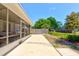A long patio extends into the backyard with the screened-in porch visible at 3119 Mango Tree Dr, Edgewater, FL 32141