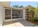 Cozy screened-in porch, perfect for enjoying the outdoors at 3119 Mango Tree Dr, Edgewater, FL 32141