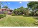 View of large, private backyard offering expansive green space for outdoor activities and relaxation at 3513 Kilgallen Ct, Ormond Beach, FL 32174