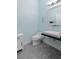 Bathroom featuring a floating sink with modern faucet and a decorative anchor at 3513 Kilgallen Ct, Ormond Beach, FL 32174