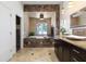 Luxurious bathroom with soaking tub, elegant marble countertops, and fireplace at 3513 Kilgallen Ct, Ormond Beach, FL 32174