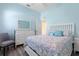 Comfortable bedroom featuring coastal decor, a queen bed with decorative pillows, and a white dresser at 3513 Kilgallen Ct, Ormond Beach, FL 32174