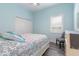 Cozy bedroom features neutral decor, and natural light through a window with privacy blinds at 3513 Kilgallen Ct, Ormond Beach, FL 32174