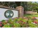 Halifax Plantation Golf Club entrance sign with brickwork and colorful flower beds at 3513 Kilgallen Ct, Ormond Beach, FL 32174
