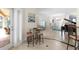 Welcoming entryway featuring a piano, decorative art, and access to the outdoor seating area at 3513 Kilgallen Ct, Ormond Beach, FL 32174