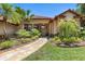 Inviting front entrance with a stone pathway and lush landscaping leading to the front door at 3513 Kilgallen Ct, Ormond Beach, FL 32174