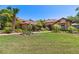 Beautiful single-story home with a lush green lawn and manicured landscaping, showcasing its curb appeal at 3513 Kilgallen Ct, Ormond Beach, FL 32174