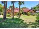 Charming home with mature trees, lush landscaping, and a well-maintained lawn, showcasing its inviting appeal at 3513 Kilgallen Ct, Ormond Beach, FL 32174