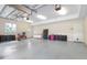 Spacious three car garage featuring high ceilings, two garage doors, and ample storage space at 3513 Kilgallen Ct, Ormond Beach, FL 32174