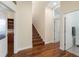 Spacious hallway features wood floors, a staircase, and access to multiple rooms throughout the home at 3513 Kilgallen Ct, Ormond Beach, FL 32174