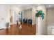 Inviting hallway featuring hardwood floors with furniture and an open floor plan to other living spaces at 3513 Kilgallen Ct, Ormond Beach, FL 32174