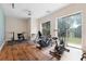 Bright home gym filled with various exercise machines and large windows at 3513 Kilgallen Ct, Ormond Beach, FL 32174