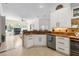 Stylish kitchen featuring granite countertops, stainless appliances, and an open view to the living area at 3513 Kilgallen Ct, Ormond Beach, FL 32174