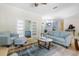 Open-concept living room with elegant furniture, a chandelier, and access to other rooms at 3513 Kilgallen Ct, Ormond Beach, FL 32174