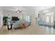 Spacious living room with neutral tones, a chandelier, and a large window for natural light at 3513 Kilgallen Ct, Ormond Beach, FL 32174