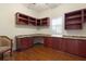Home office with hardwood floors, custom built-in cabinets and granite countertops at 3513 Kilgallen Ct, Ormond Beach, FL 32174