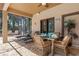 Screened patio with a dining table, lounge chairs, and view of lush tropical landscaping at 3513 Kilgallen Ct, Ormond Beach, FL 32174