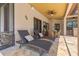 Covered patio with lounge chairs, a dining table, and view of the tropical landscaping at 3513 Kilgallen Ct, Ormond Beach, FL 32174