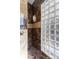 Shower featuring elegant tiling and glass block accent wall at 3513 Kilgallen Ct, Ormond Beach, FL 32174