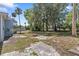 Backyard with mature trees and a fire pit at 509 Park Dr, Daytona Beach, FL 32114