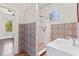 Bathroom featuring decorative tile, a walk-in shower, and a sleek white vanity at 509 Park Dr, Daytona Beach, FL 32114