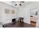 Bedroom area with wood floors, white trim and windows with an open door to the living room at 509 Park Dr, Daytona Beach, FL 32114