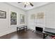 Bright bedroom featuring windows, ceiling fan, and dark wood flooring at 509 Park Dr, Daytona Beach, FL 32114