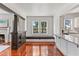 Open dining room with fireplace, hardwood floors, window seat and granite countertop at 509 Park Dr, Daytona Beach, FL 32114
