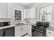 Updated kitchen featuring white cabinets, granite countertops, and modern appliances at 509 Park Dr, Daytona Beach, FL 32114