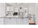 Bright kitchen with white cabinets, stainless steel appliances, and granite countertops at 509 Park Dr, Daytona Beach, FL 32114