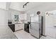 Updated kitchen featuring white cabinets, stainless steel appliances, and bright, natural light at 509 Park Dr, Daytona Beach, FL 32114