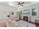 Bright living room features a fireplace, hardwood floors, and comfortable seating with lots of natural light at 509 Park Dr, Daytona Beach, FL 32114