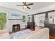 Bright living room features a fireplace, hardwood floors, and an open layout to the kitchen at 509 Park Dr, Daytona Beach, FL 32114