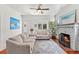 Bright living room features a fireplace, hardwood floors, and comfortable seating with lots of natural light at 509 Park Dr, Daytona Beach, FL 32114