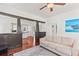 Living room with vintage columns and doorway leading into updated kitchen at 509 Park Dr, Daytona Beach, FL 32114