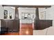 View of living room featuring classic columns and opening to the kitchen at 509 Park Dr, Daytona Beach, FL 32114