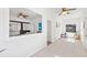 Sunroom with white walls and ceramic tile overlooking living room and fireplace at 509 Park Dr, Daytona Beach, FL 32114