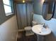 Cozy bathroom featuring a pedestal sink, toilet, and a shower with curtain at 601 E Tall Pine Ter, Deland, FL 32724