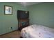 This simple bedroom has a floral bedspread and a modern television at 601 E Tall Pine Ter, Deland, FL 32724