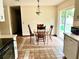 Cozy eat-in kitchen with a dining table near sliding glass doors at 601 E Tall Pine Ter, Deland, FL 32724