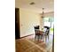 Inviting dining area with tile flooring and a pendant light fixture at 601 E Tall Pine Ter, Deland, FL 32724