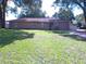 Charming single-story home featuring a manicured lawn and inviting front entrance at 601 E Tall Pine Ter, Deland, FL 32724